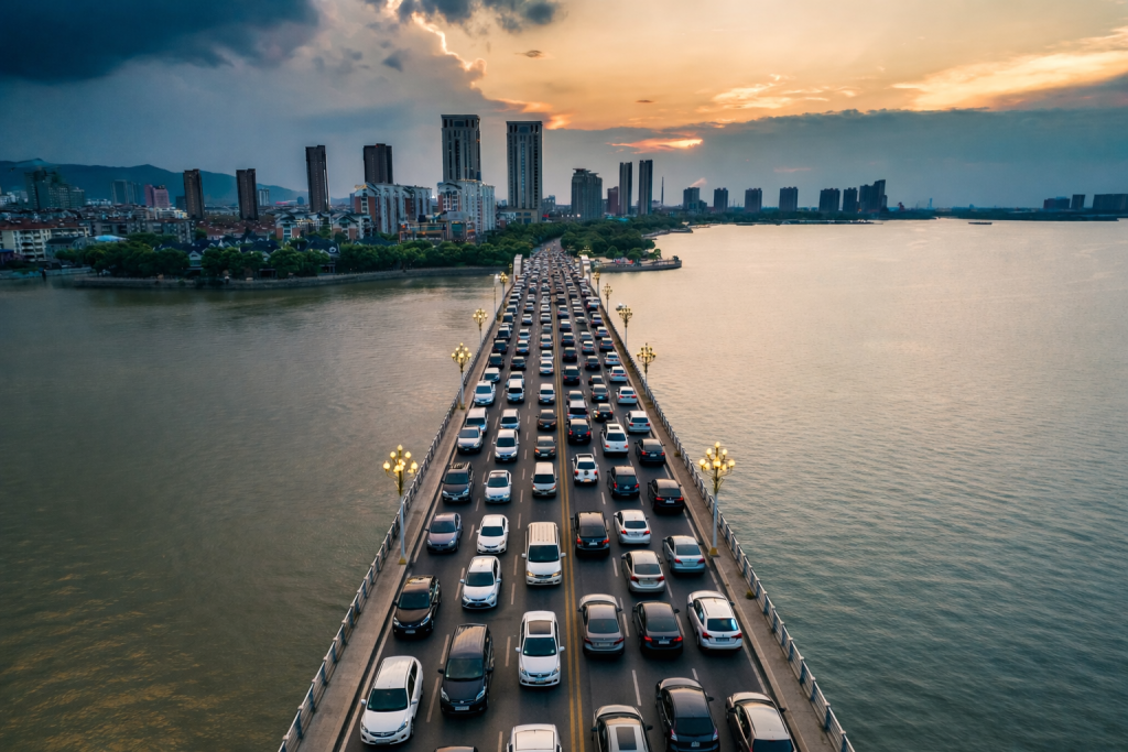 High-traffic land border between Malaysia and Singapore with thousands of daily commuters, cars and motorcycles forming dense movement patterns across the causeway.