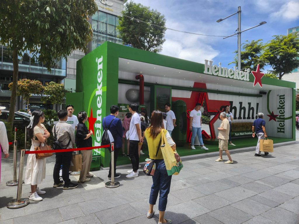 Brand activation campaign by Heineken on Orchard Road, Singapore, featuring eye-catching outdoor advertising elements in a prime shopping district.