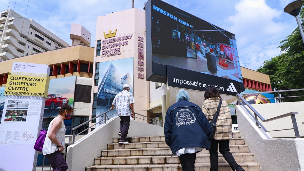 Outdoor digital billboard advertising at Queensway Shopping Centre showcasing DOOH campaign placement by The Perfect Media for The Complete A–Z Marketing, OOH, DOOH, B2B & Advertising Terminology Guide (2026 Edition).