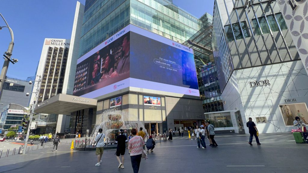 UOB digital billboard at Pavilion Kuala Lumpur, showcasing premium outdoor advertising on large-format digital screens in a high-traffic retail district in 2026.
