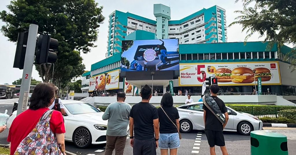DOOH digital advertising screen located at the entrance of Queensway Shopping Centre on Alexandra Road, Singapore