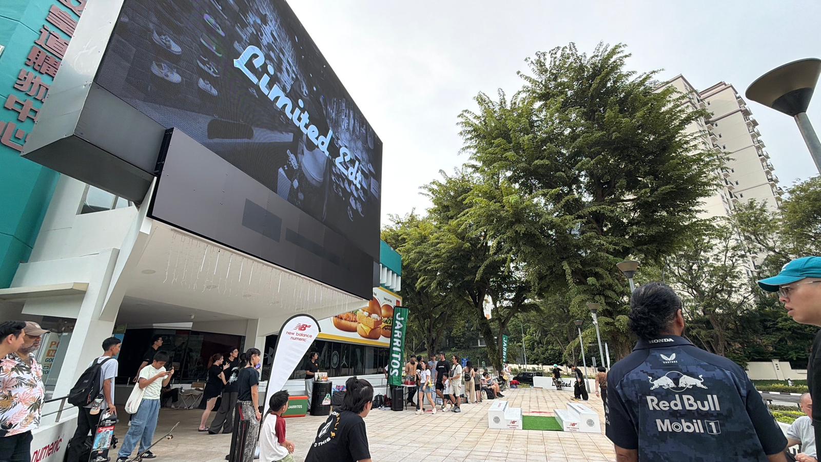 Large digital LED screen by The Perfect Media displaying Limited Edt branding during a skate event at Queensway Shopping Centre.